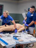 Clinicians from the Penn Trauma team, including Navy team members, train together in a simulation exercise.