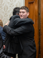 John Pryor, Jr. embracing an attendee