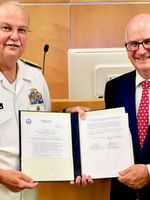 Gillinghamn (left) and Mahoney (right) holding agreement