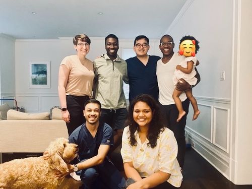 A photo of the lab in 2021, featuring Dr. Amankulor, Zel, Jordan, Katharine, Poorva, Emade, and Dr. Amankulor's dog Kobe.