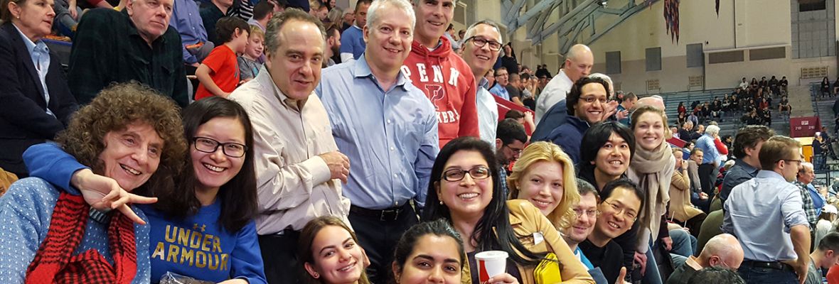 A group picture of individuals on bleachers at the Palestra