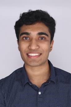 image of a student in front of a gray background.