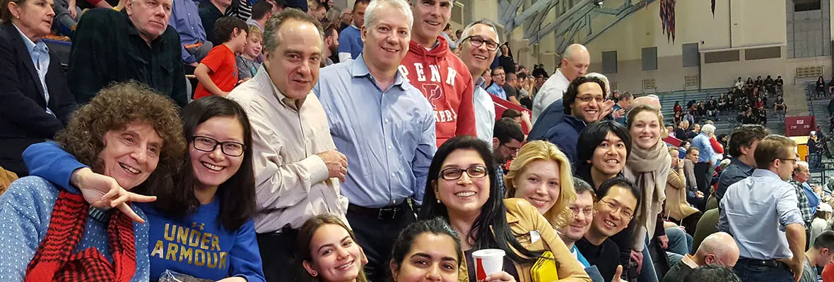 A group picture of individuals on bleachers at the Palestra