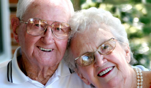 elderly couple smiling