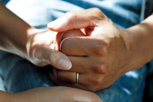 Two people holding hands