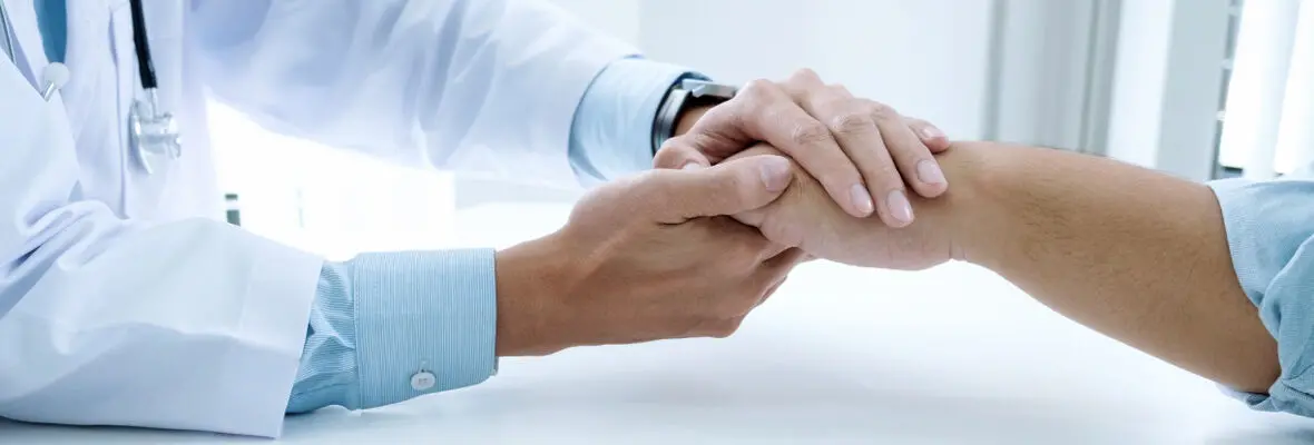 Doctor Examining Patient's Hand