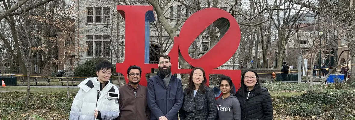 Wang Group in front of Love statue in January 2023