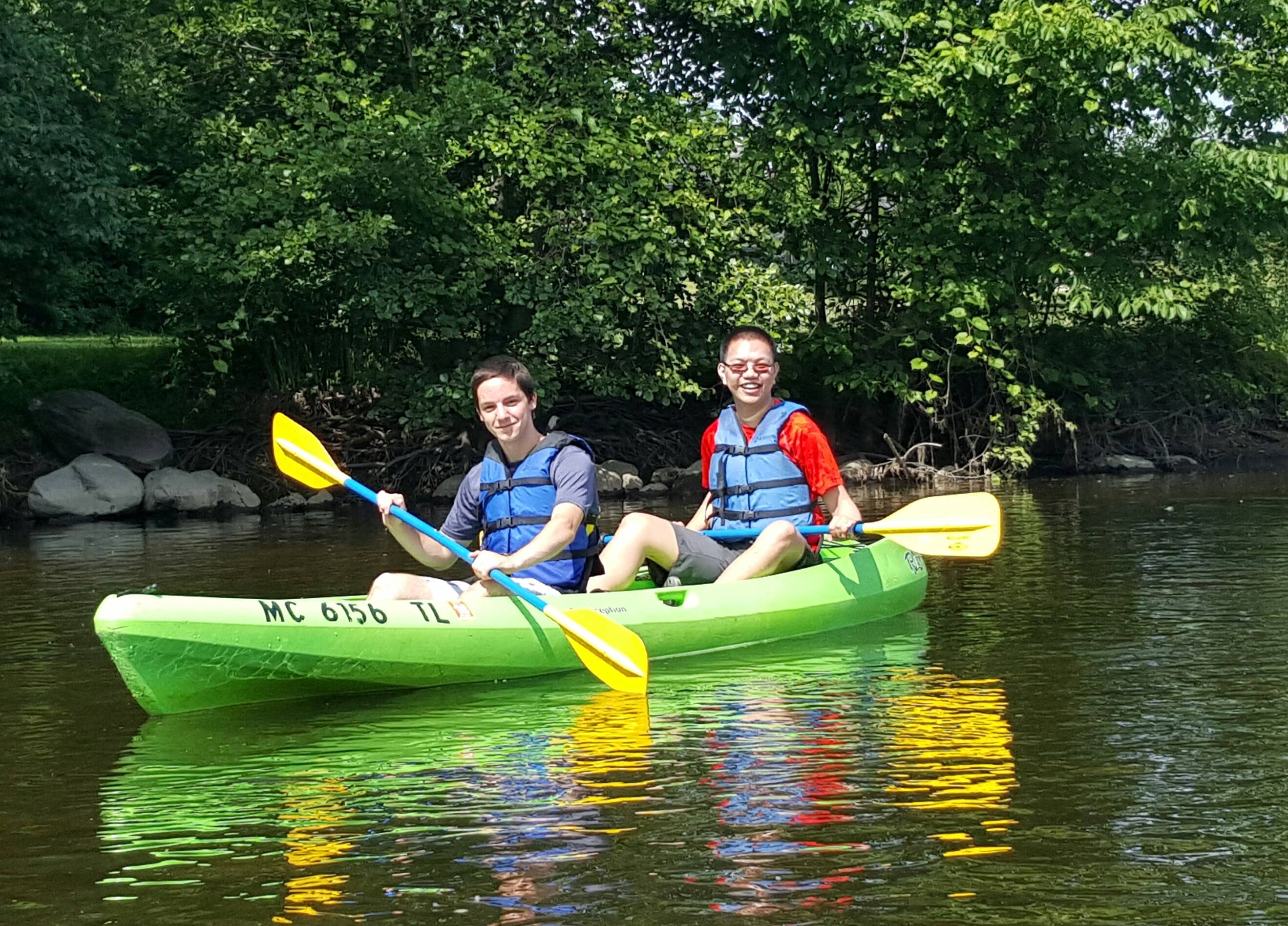 two people in a yellow kayak