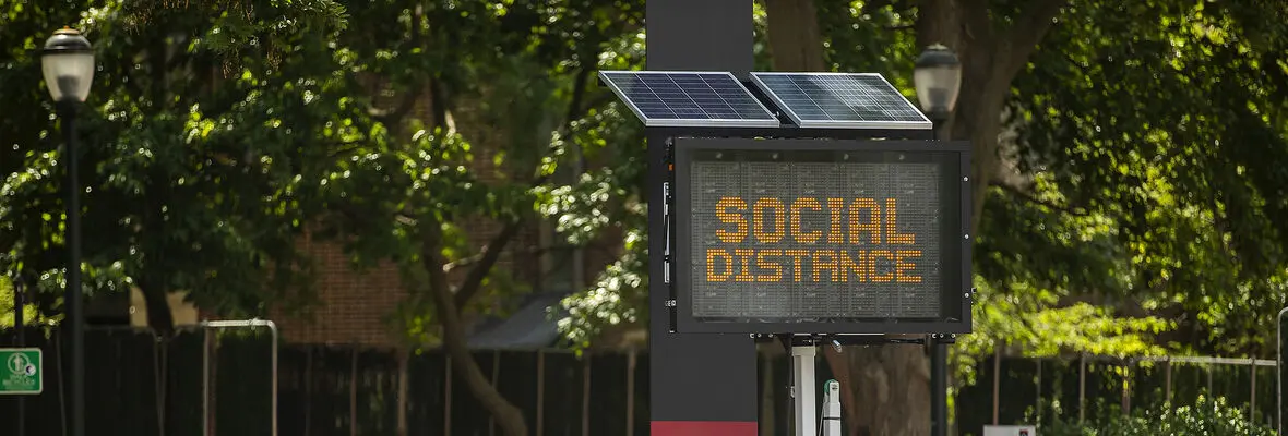 photo showing digital social distance sign