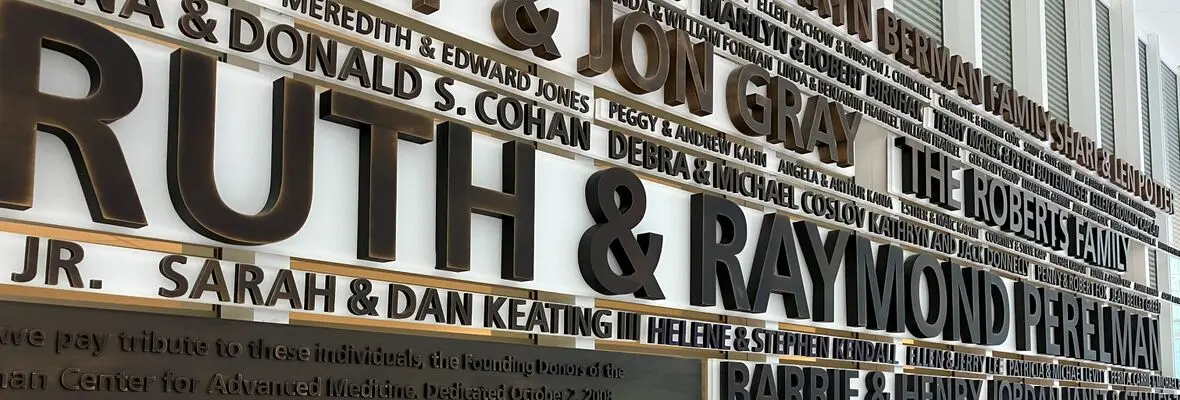 Ruth and Raymond Perelman name sign with other donor names around theirs. Located in the lobby of the Perelman Center.