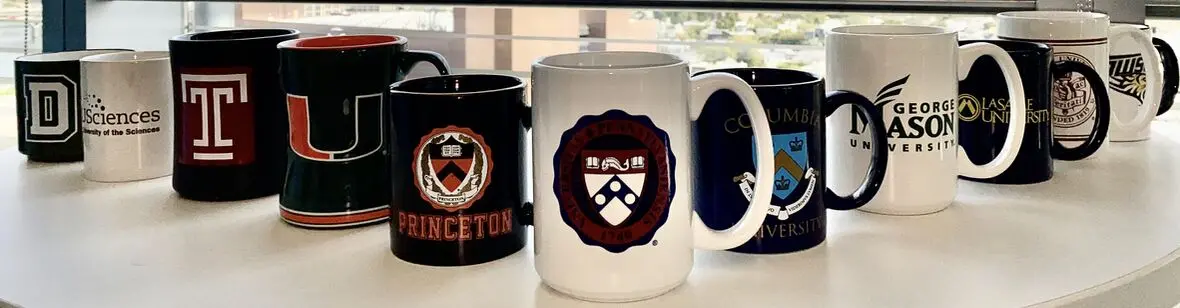 Collection of collegiate mugs