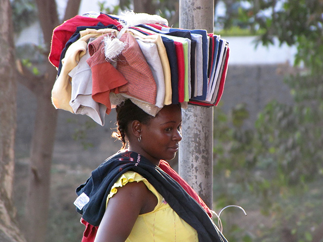 woman carrying clothes on her head