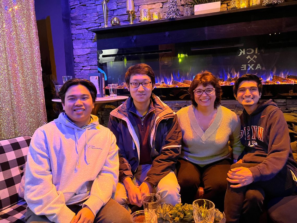 Several lab members smile and pose together 