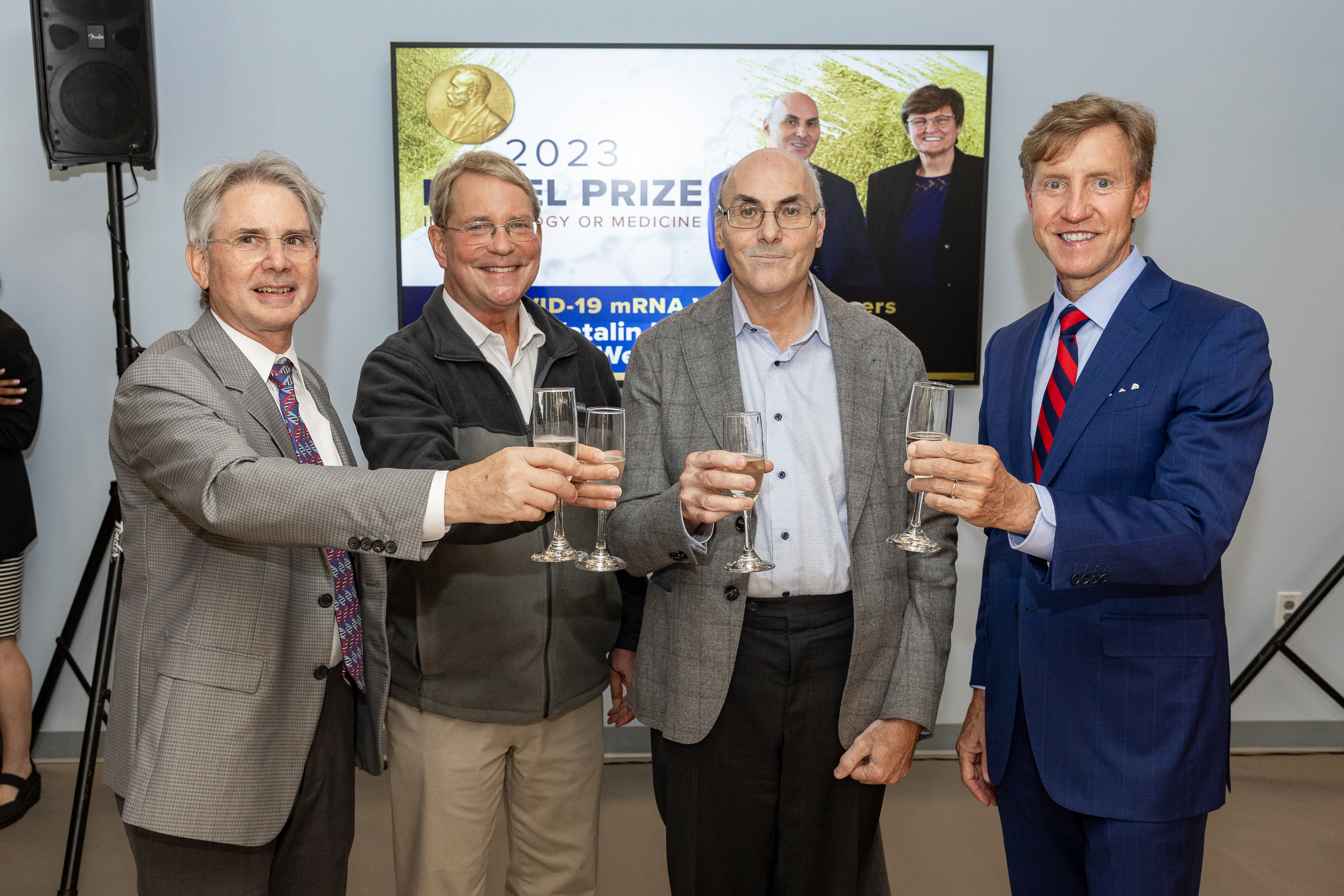 Jon Epstein, Jim Hoxie, Drew Weissman & J. Larry Jameson toasting champagne