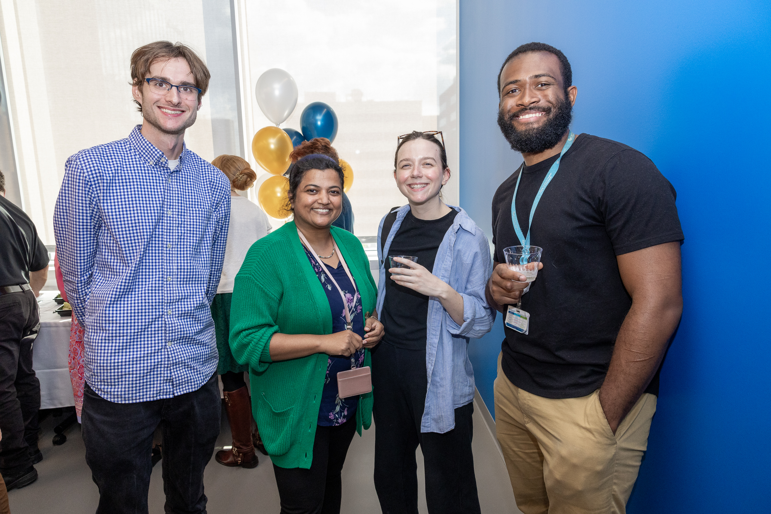 Lab members, Ben  & Garima with two guests